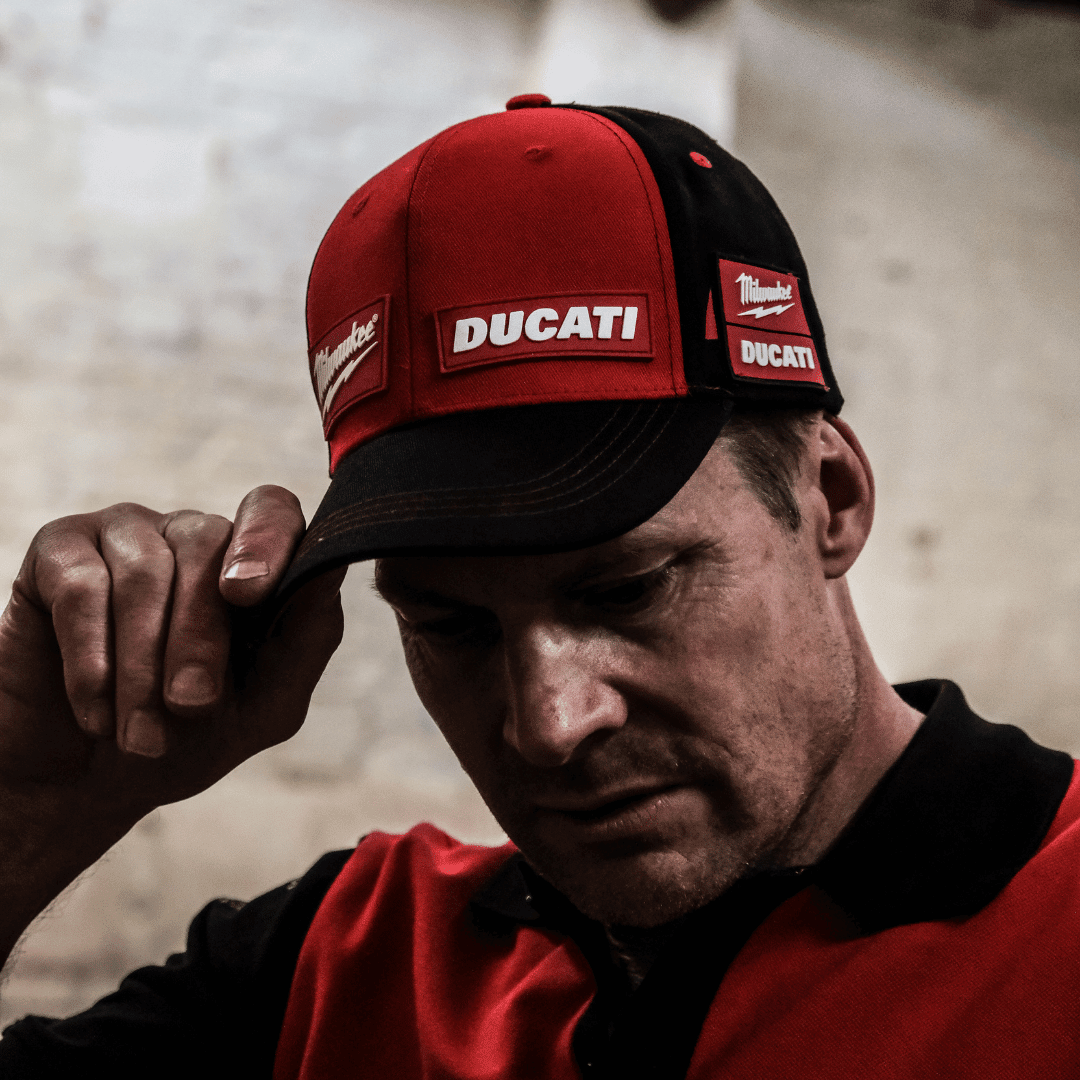 Milwaukee Tools x Ducati team-wear trucker hat featuring racing graphics and branding, casual baseball cap style.