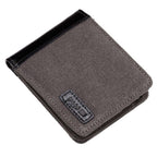 Charcoal canvas bi-fold wallet by Troop London featuring multiple card slots and a sleek, minimalist design.