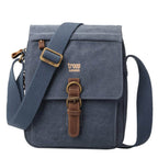 Troop London charcoal canvas crossbody bag with organizer, adjustable strap, and multiple compartments for everyday use.
