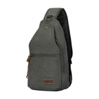 Black canvas sling backpack with single strap from Troop London, stylish and compact for everyday use.