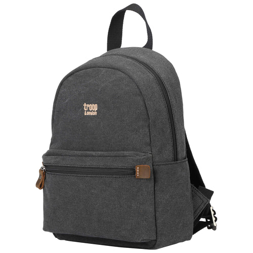Small black classic canvas backpack by Troop London with stone-washed finish and sturdy straps.