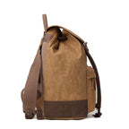 Troop London Heritage waxed canvas laptop backpack in camel color with leather accents and multiple compartments.