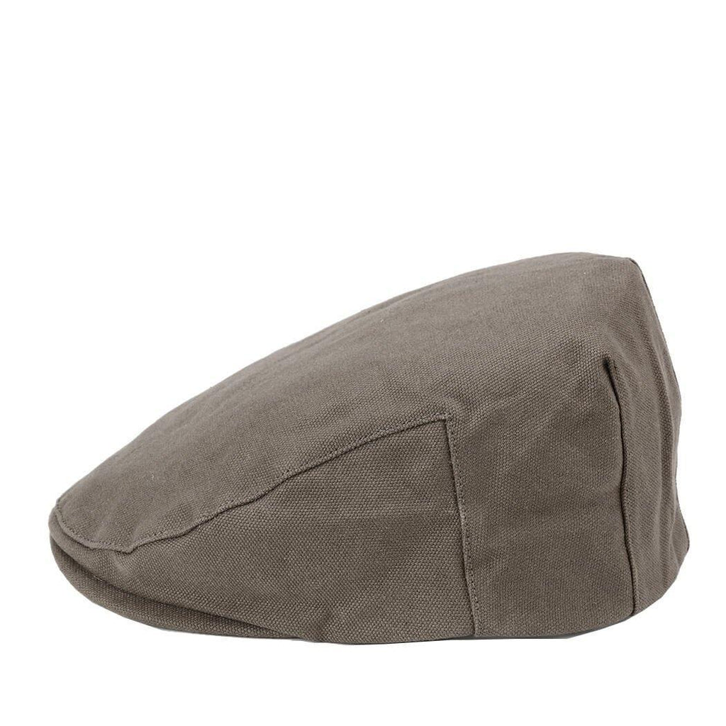 Olive waxed canvas flat cap by Troop London, stylish hat with a classic shape and textured fabric.