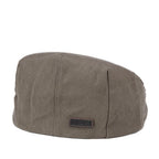 Olive waxed canvas flat cap by Troop London, stylish hat with a classic rounded brim and textured fabric detail.