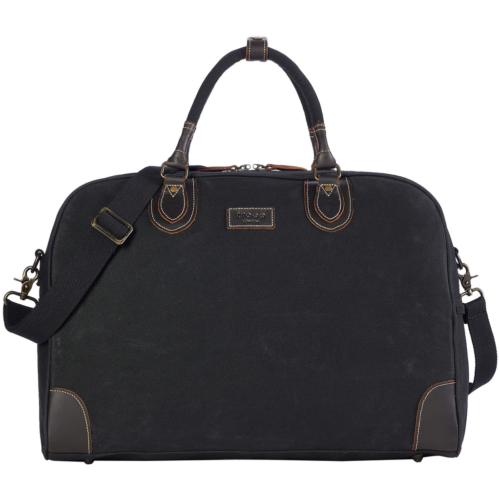 Large charcoal canvas travel holdall by Troop London, 45L capacity, durable luggage bag with sturdy handles for travel.