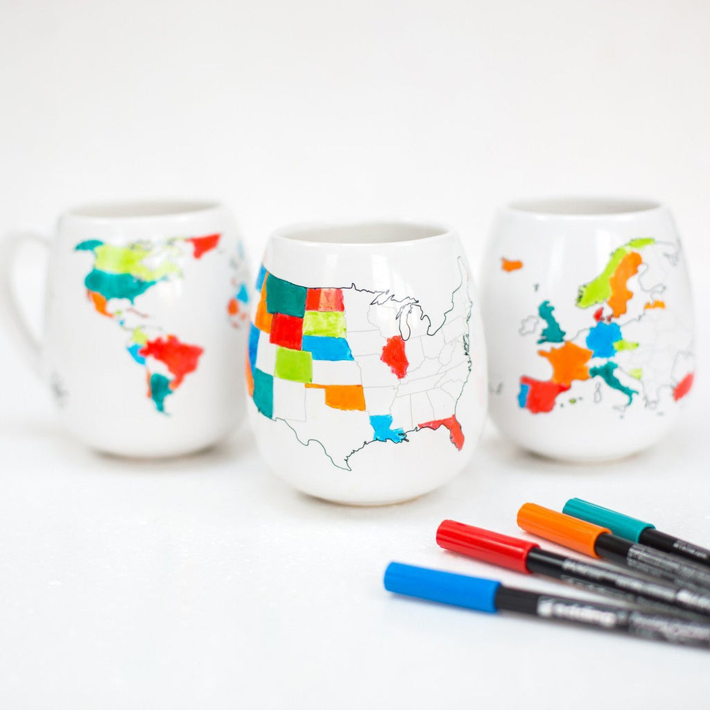 Set of four Trouvaille ceramic pens with sleek, white design, perfect for writing and artistic projects.
