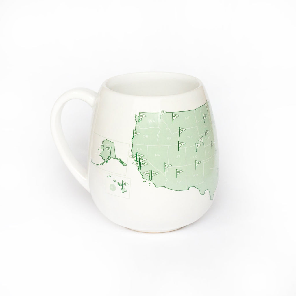 Color-in mug featuring US golf courses, by Trouvaille, with detailed golf course illustrations ready for coloring.