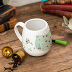 Color-in mug featuring US National Parks design by Trouvaille, with detailed park illustrations on a ceramic mug.