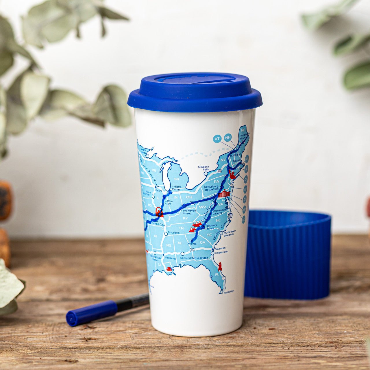 Trouvaille US Road Trip Map color-in travel mug featuring a vibrant USA map design on a ceramic cup.