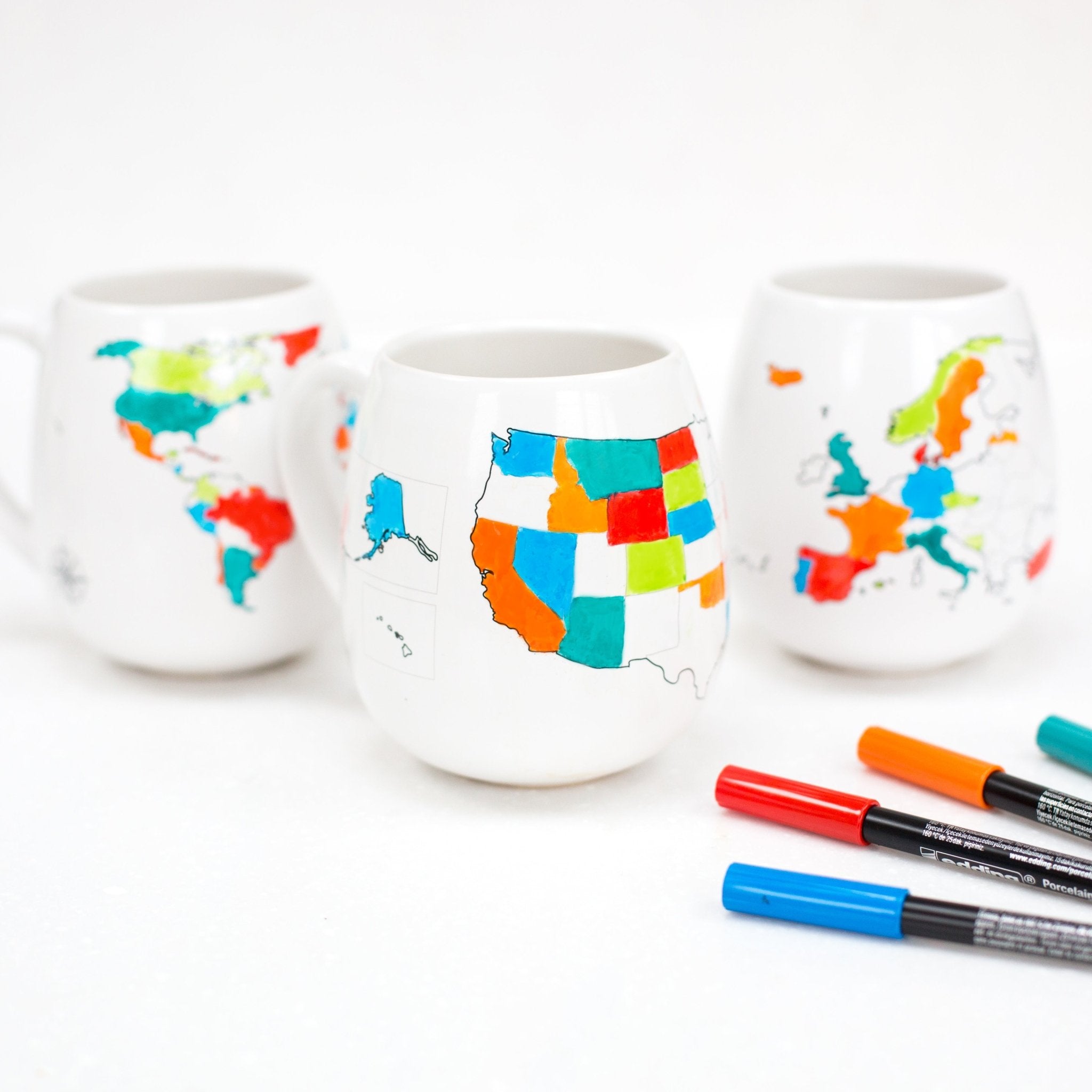 Trouvaille USA Map color-in travel mug with markers for customizing, perfect for travel enthusiasts and gift-givers.