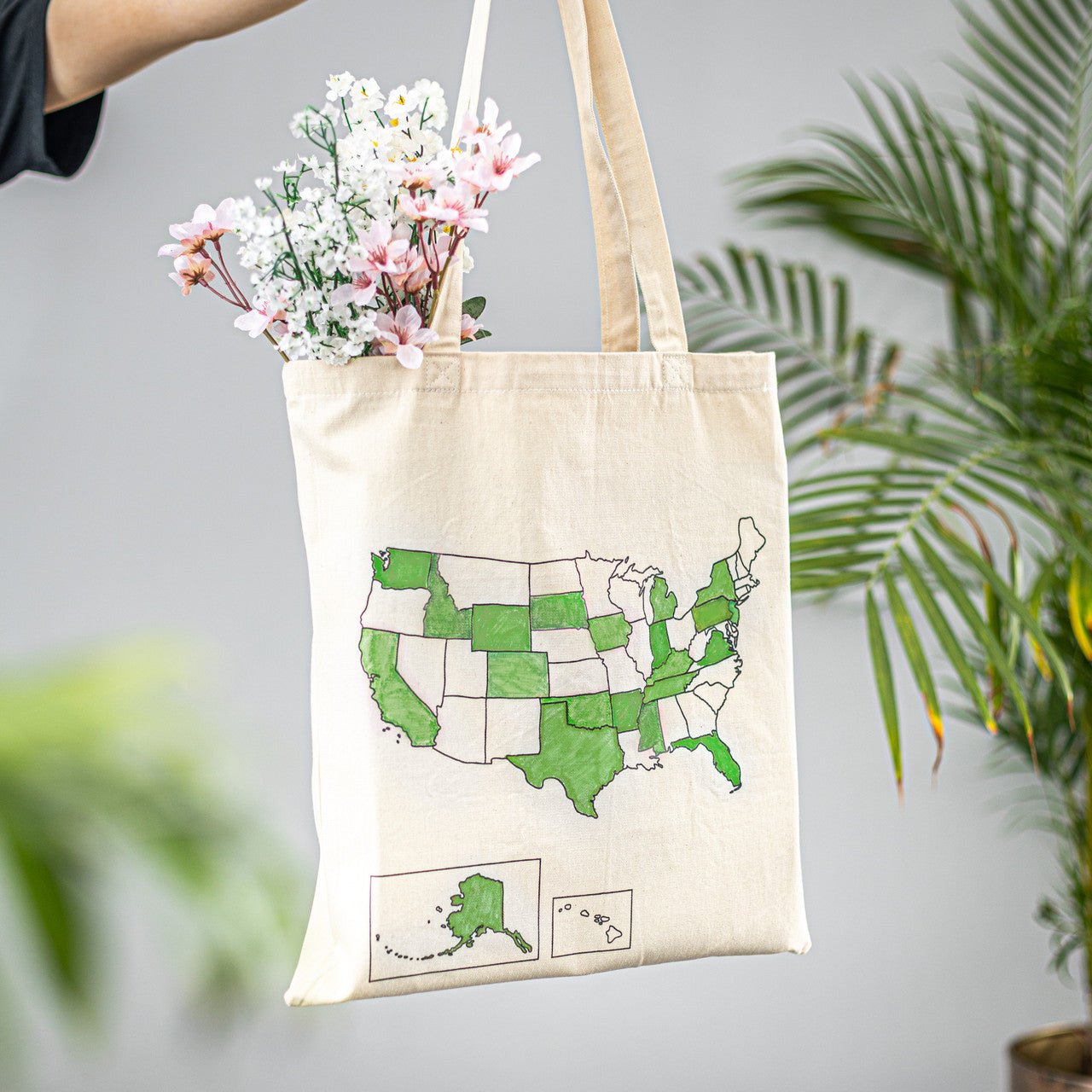 Colorful USA map tote bag by Trouvaille, featuring a vibrant travel-inspired design, perfect for carrying essentials.