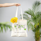 Cotton tote bag with colorful world map design, ideal for travel and everyday use, by Trouvaille.