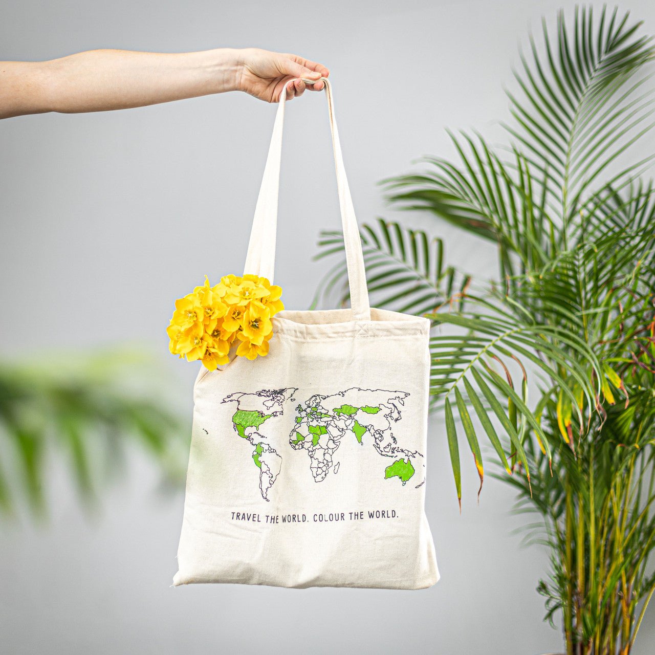 Trouvaille world map color-in travel tote bag with vibrant map design, spacious tote for travel essentials and everyday use.