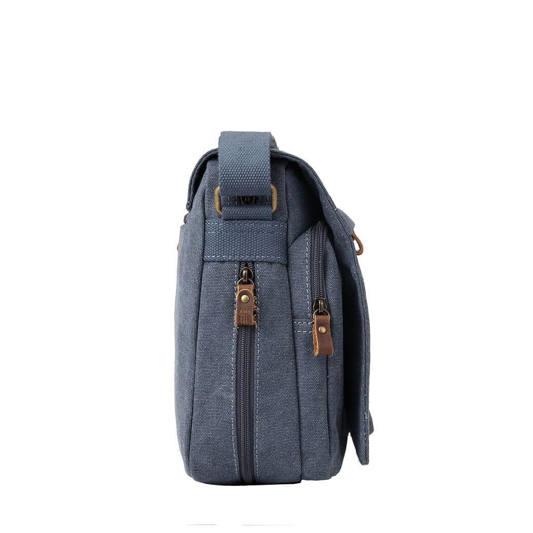Troop London TRP0241 blue messenger bag with adjustable strap and front pocket, designed for stylish everyday use.
