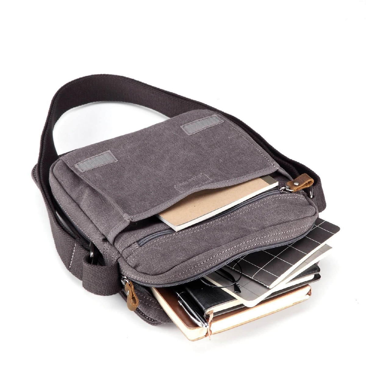 Inside view of black Troop London TRP0242 canvas crossbody bag with organiser compartments