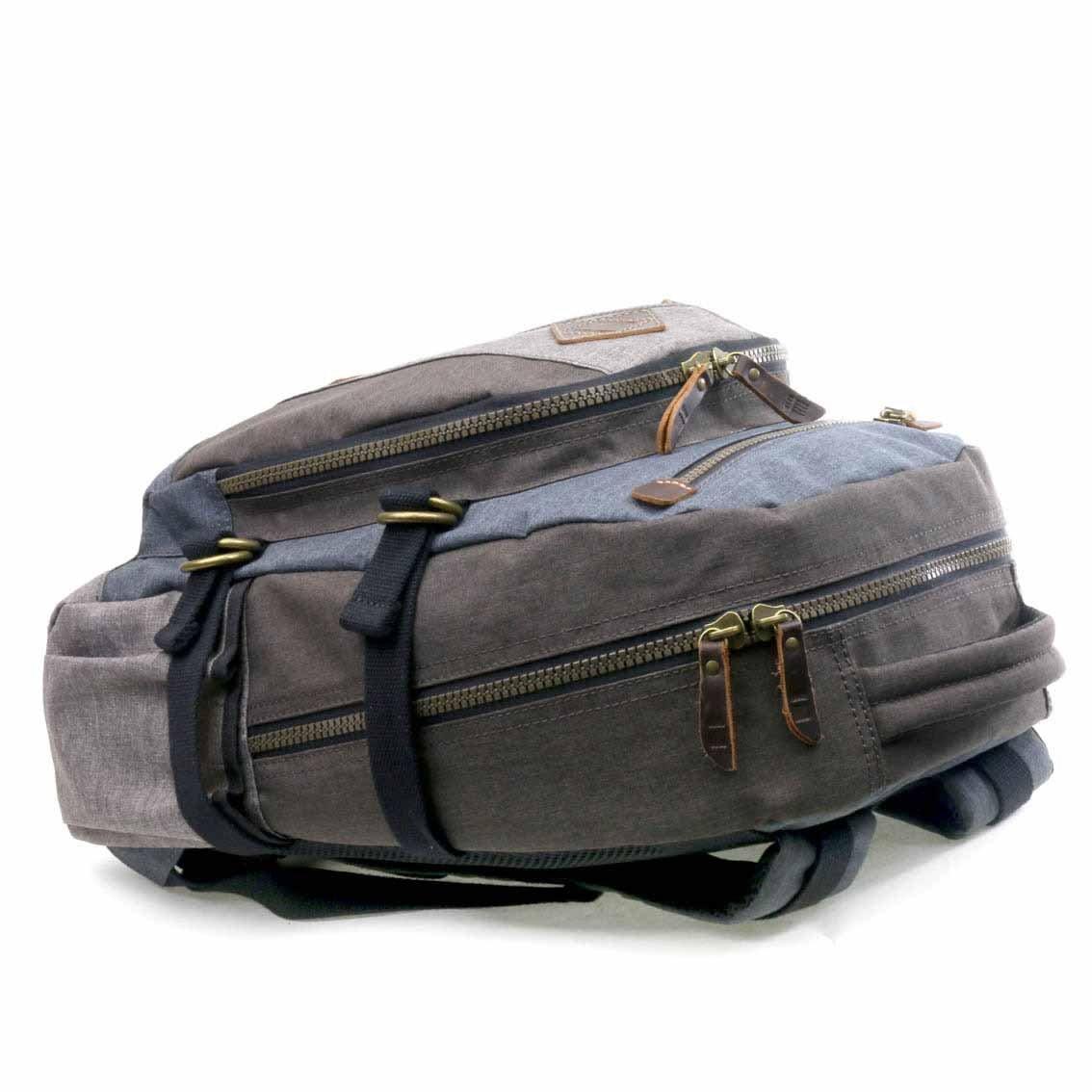 Troop London TRP0385 laptop backpack shown from the side, featuring a sleek design with padded shoulder straps and multiple compartments.