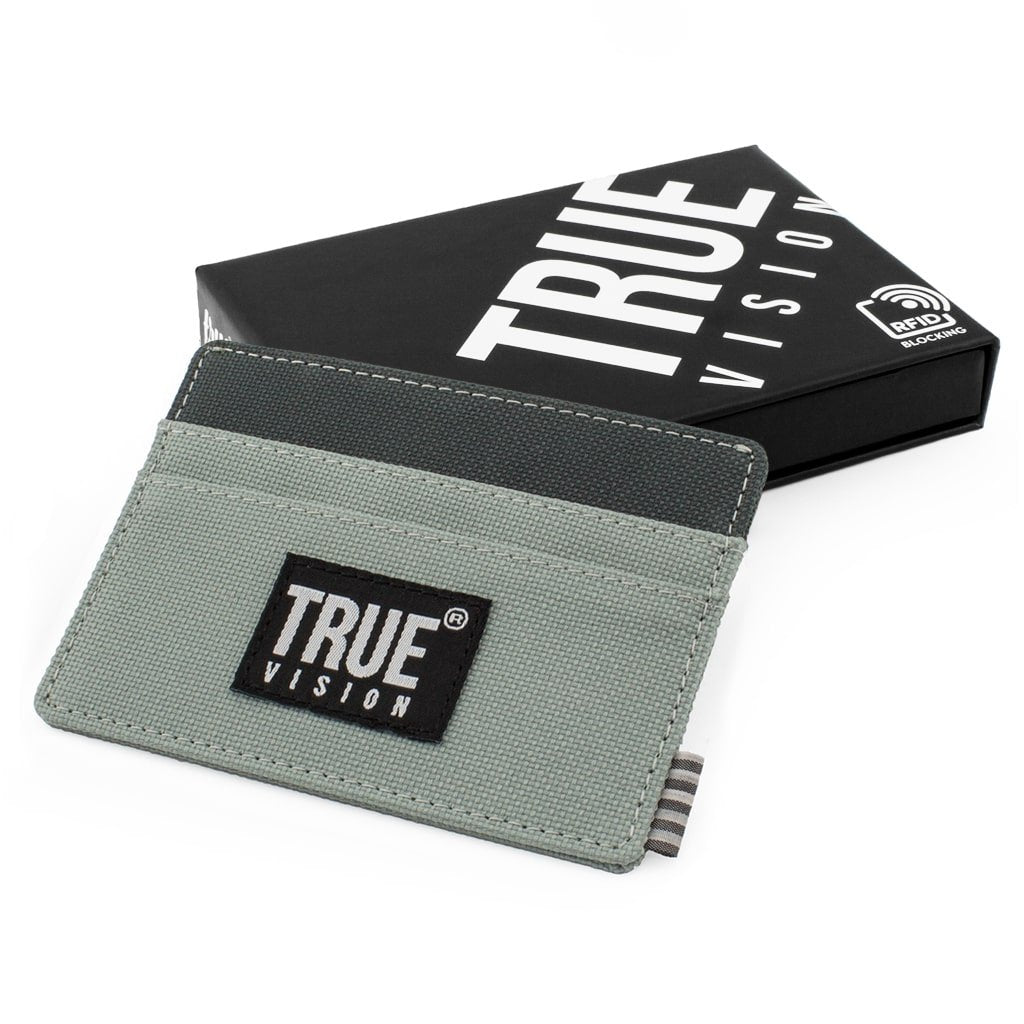 Black slim card wallet by truevisionbrand, made of durable canvas, designed for compact storage of cards and cash.