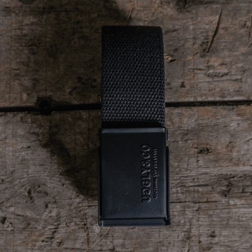 Black canvas utility belt from Uggly and Co with multiple pouches and buckle, designed for practical accessories and casual wear.