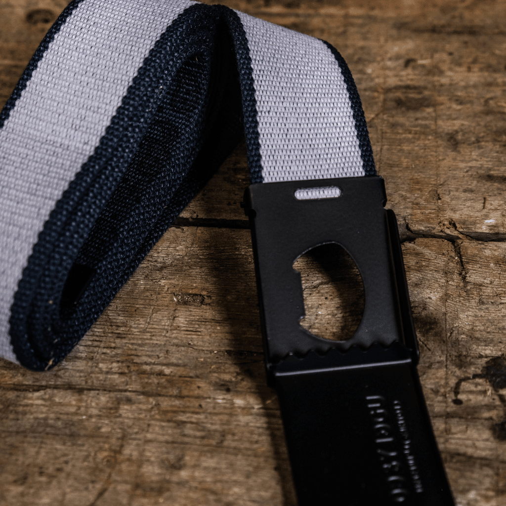 Blue canvas utility belt from Uggly and Co, adjustable accessories with metal buckle and multiple pouches for practical wear.