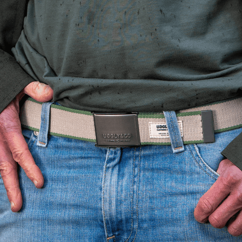 Green canvas utility belt from Uggly and Co, adjustable accessories belt with multiple pouches and durable design.