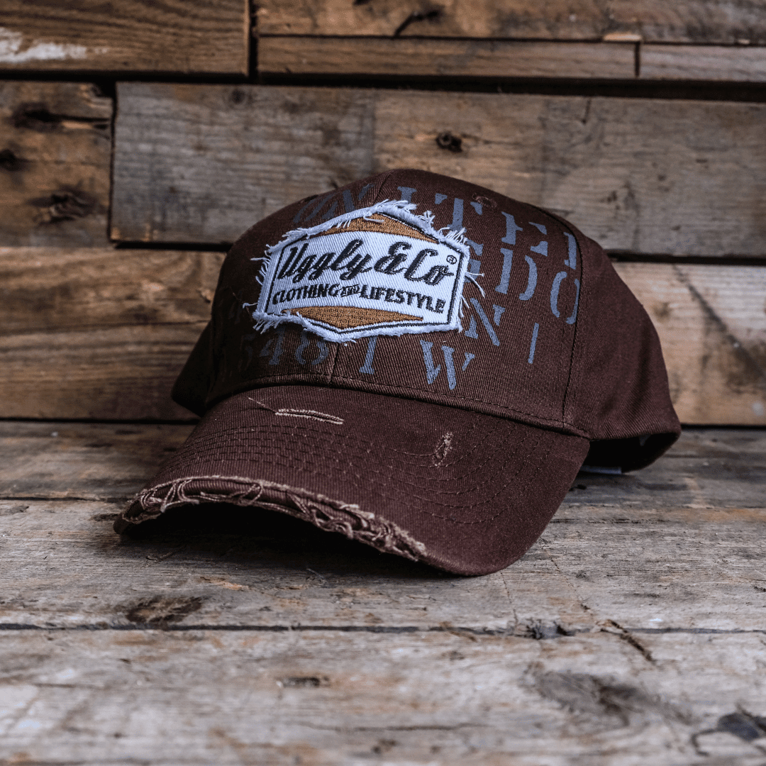 Vintage brown 'Aviation' diamond trucker cap by Uggly and Co, featuring a classic baseball cap style with embroidered aviation design.