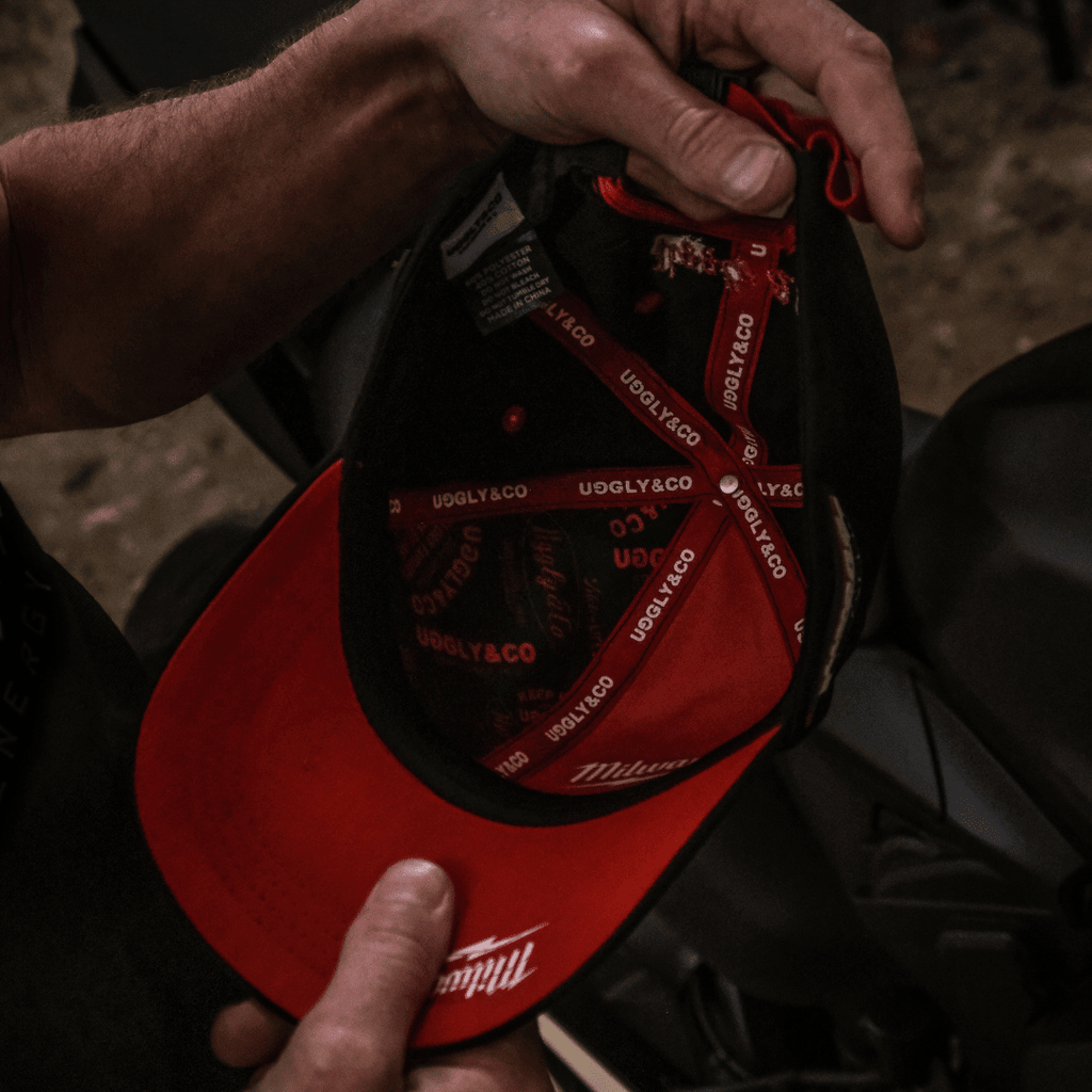 Uggly and Co Diamond Trucker Hat with Milwaukee Tools logo, featuring a classic baseball cap design in durable fabric.