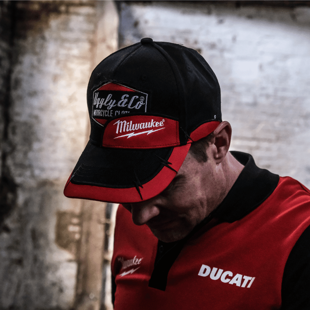 Uggly and Co Diamond Trucker Hat with Milwaukee Tools branding, featuring a classic baseball cap design and mesh back.