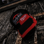 Uggly and Co Diamond Trucker Hat baseball cap with Milwaukee Tools logo featuring a mesh back and structured front panel.