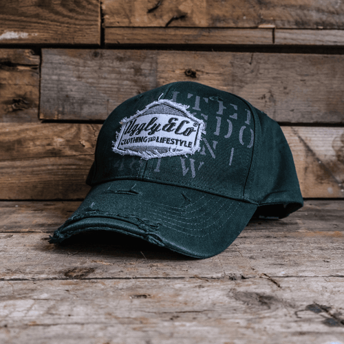 Green Uggly and Co Aviation Diamond Trucker Hat, baseball cap with embroidered diamond design and adjustable snapback closure.