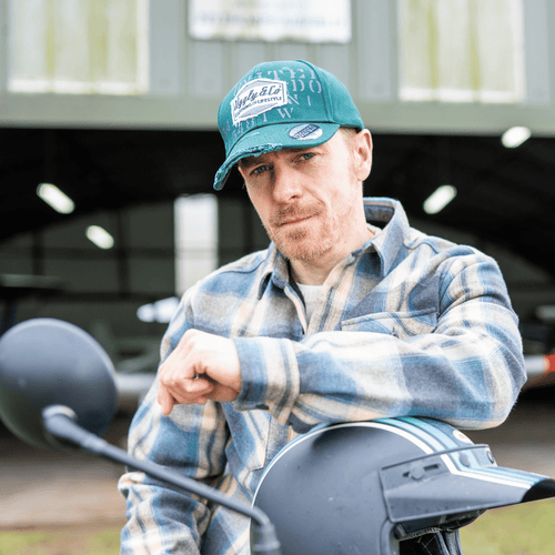 Green Uggly and Co Aviation Diamond Trucker Hat, classic baseball cap with embroidered logo and mesh back for a stylish look.