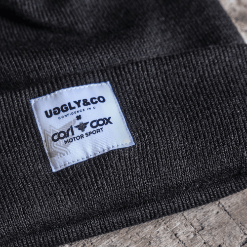 Uggly and Co Carl Cox Icon beanie featuring a stylish knit design with a logo patch on the front.