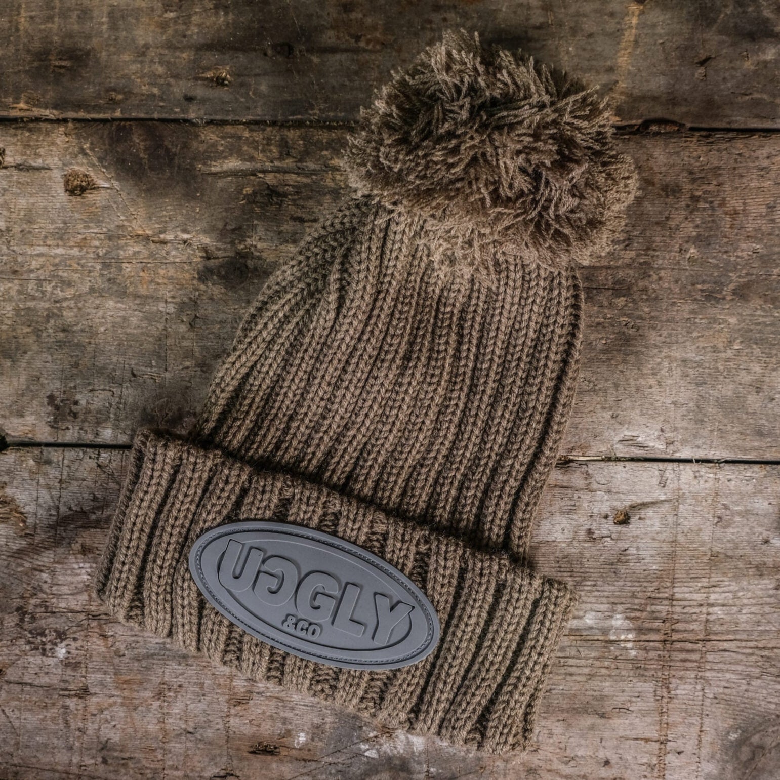 Uggly and Co Fennel Beanie in soft knit fabric, featuring a cozy fold-over design and subtle branding detail.