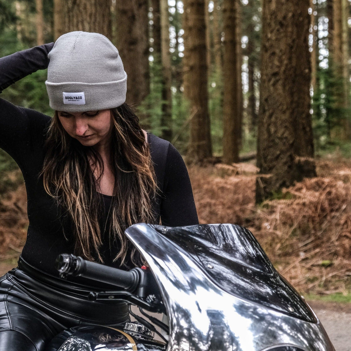 Grey Uggly and Co beanie, soft knitted fabric, snug fit, casual winter accessory displayed on a plain background.