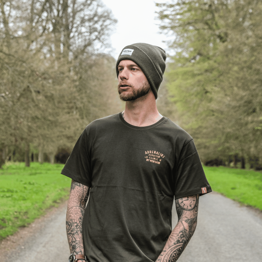 Olive Uggly and Co beanie hat with a snug knit design, perfect for cold weather and casual winter style.