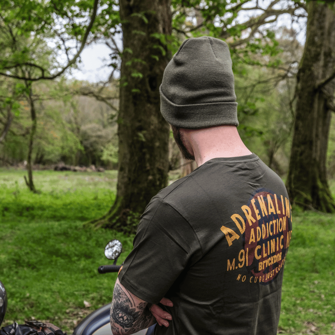 Olive Uggly and Co beanie made of soft knit fabric, featuring a snug fit and casual style perfect for cold weather.