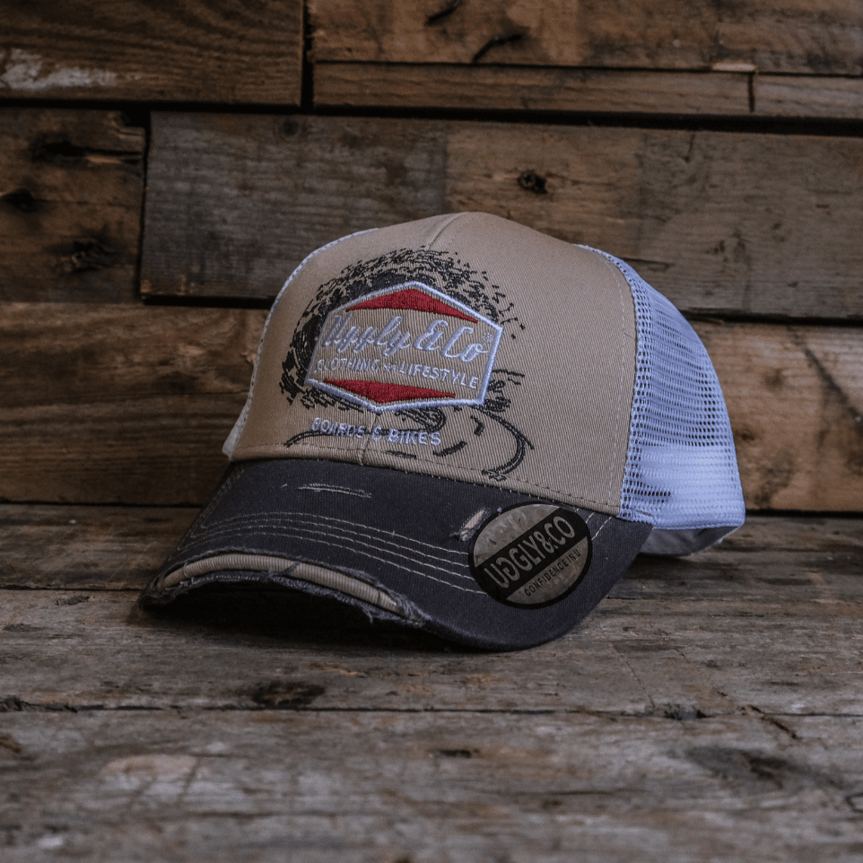Beige surf diamond trucker hat by Uggly and Co with vintage style, mesh back, and curved brim for casual beachwear.