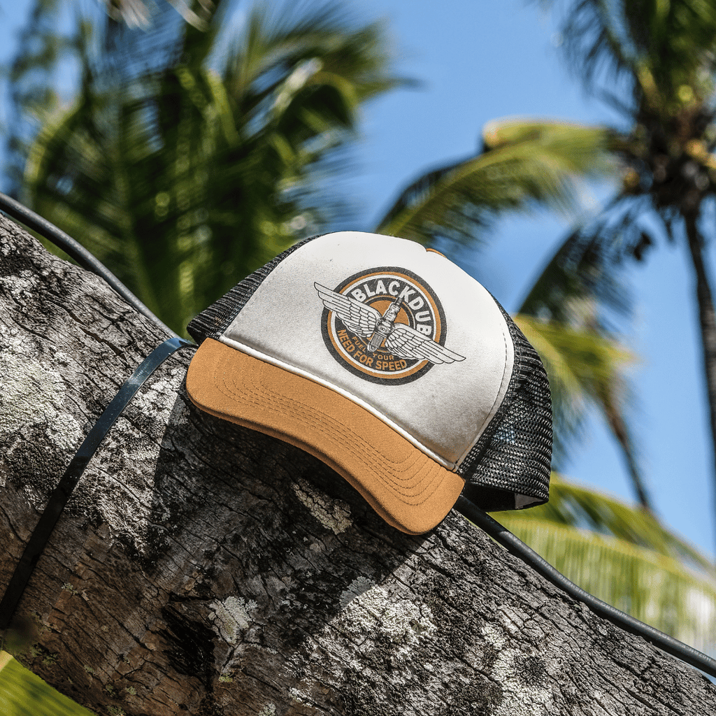 Black Uggly and Co Garage Circle Wings trucker cap with mesh back and curved brim, featuring bold wing and circle design.