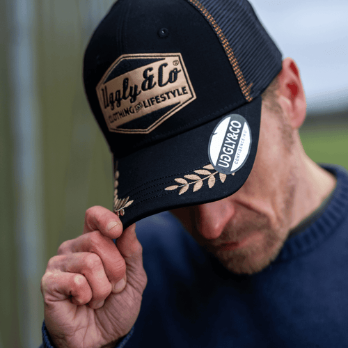 Black and gold 'Podium' diamond trucker hat by Uggly and Co, casual men's cap with a garage-inspired style and mesh back.