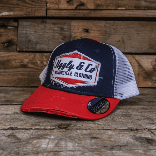 Blue and red diamond trucker cap by Uggly and Co featuring a classic mesh back and adjustable strap.