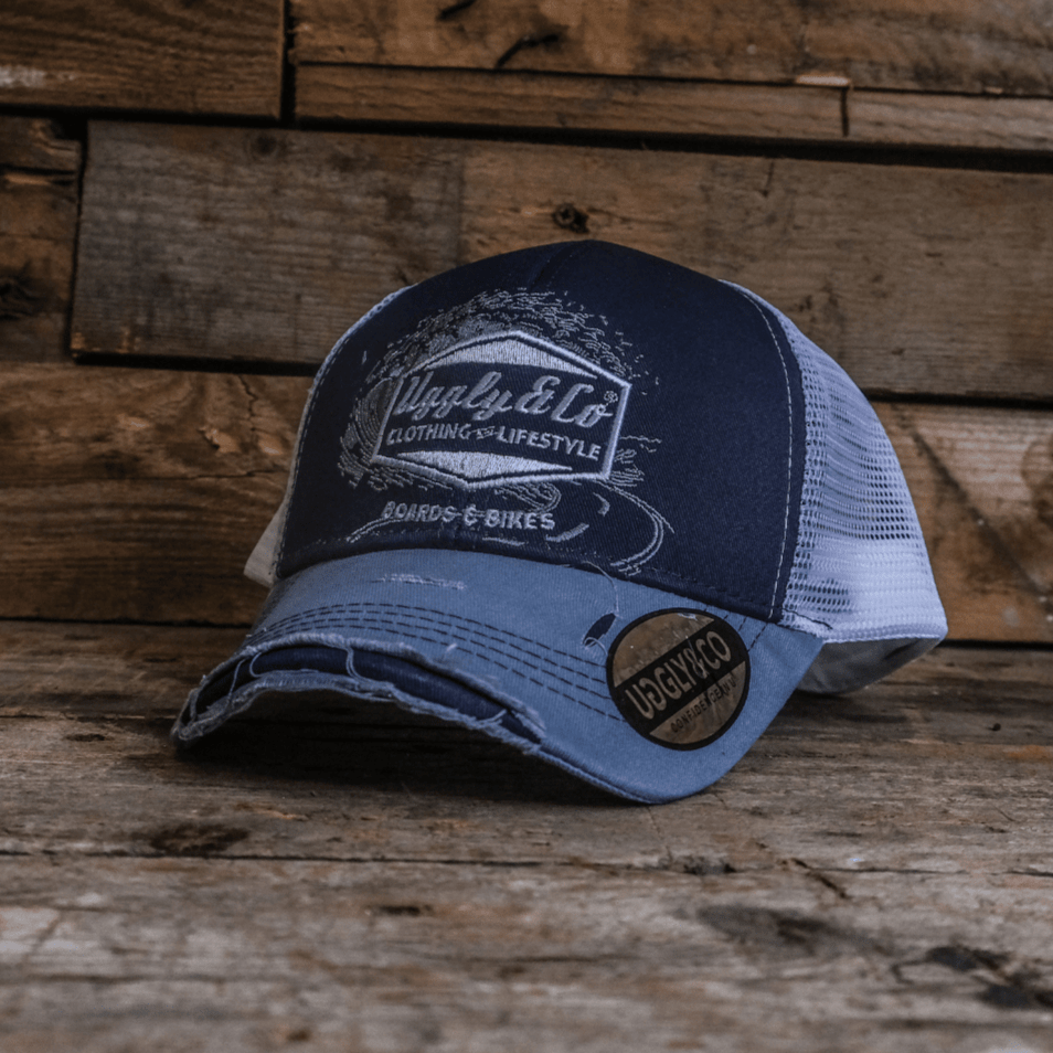 Blue surf diamond trucker hat by Uggly and Co featuring a vintage-inspired blue design and classic mesh back.