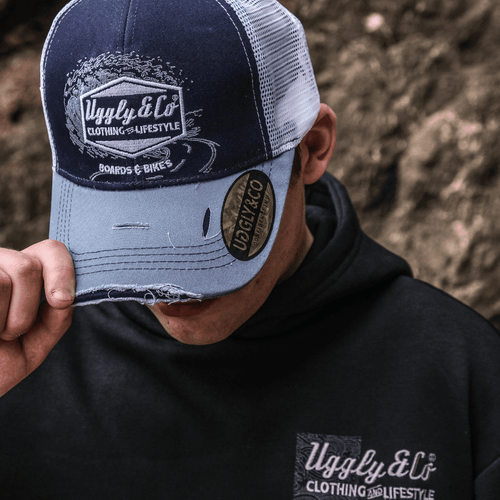 Blue Surf Diamond Trucker Cap by Uggly and Co featuring a classic trucker hat style with a blue surf diamond design.