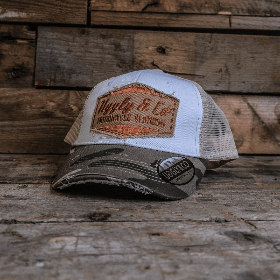 Vintage camouflage diamond trucker cap by Uggly and Co, featuring classic design and breathable mesh back for bikers.