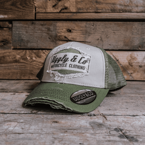 Green diamond print Uggly and Co trucker cap with mesh back and curved brim, stylish and comfortable for casual wear.