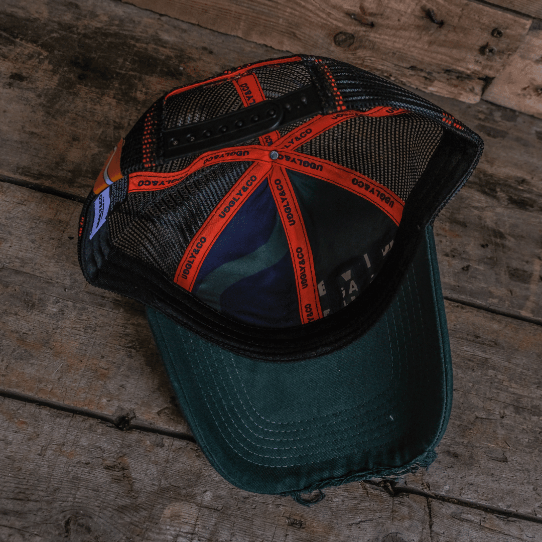 Green Parts & Spares '09' trucker hat by Uggly and Co with mesh back and adjustable strap.