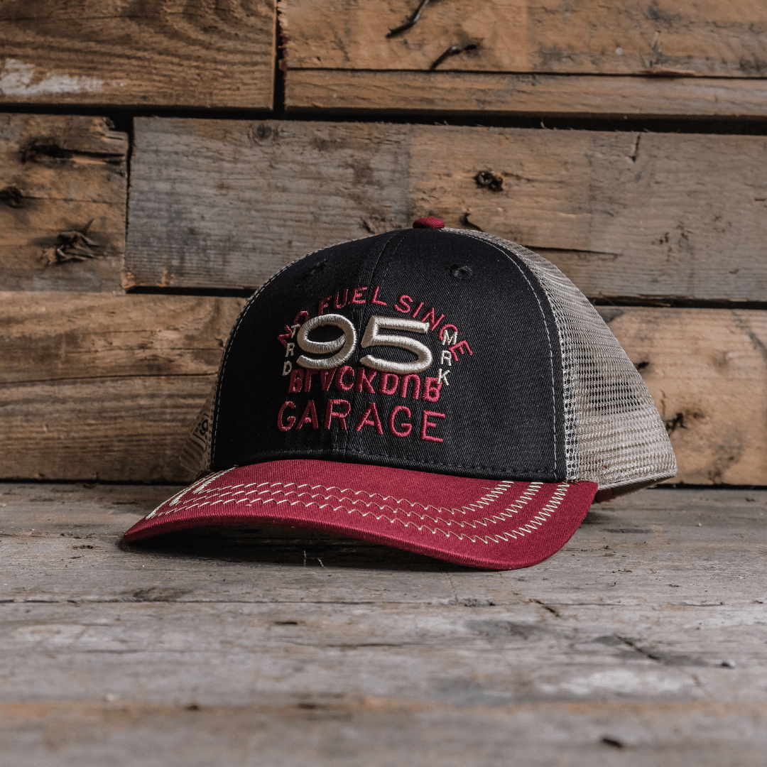 Men's vintage Uggly and Co trucker cap with "No Fuel Since 95'" embroidered front, mesh back, and adjustable snap closure.