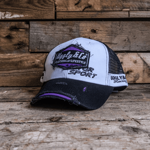 Purple diamond trucker cap by Uggly and Co featuring JDM Racing branding, with mesh back and adjustable snap closure.