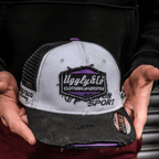 Purple diamond trucker hat by Uggly and Co featuring JDM Racing branding, with mesh back and curved brim.