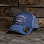 Purple Surf Diamond Trucker Hat by Uggly and Co featuring a mesh back and bold diamond graphic on the front.