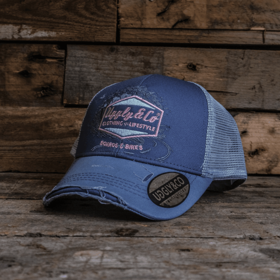 Purple surf diamond trucker cap by Uggly and Co featuring a stylish surfing design and adjustable mesh back.