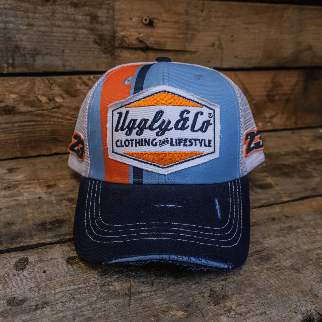 Retro blue and orange diamond trucker hat by Uggly and Co featuring a classic mesh back and bold geometric design.
